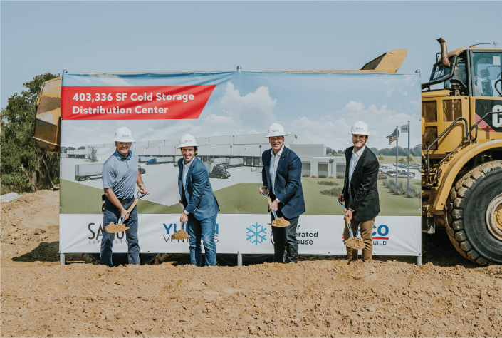 Burleson Cold Storage groundbreaking photo in front of PR step up